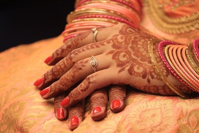Muslim bride wearing henna and Halal nail polish.
