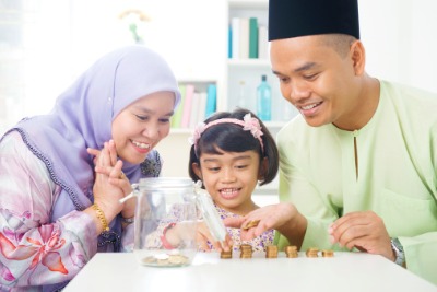 Muslim family saving together.