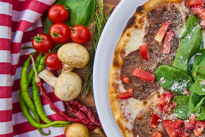 Halal pizza served with vegetables
