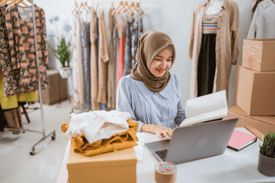 A Muslim woman running an apparel shop using online.