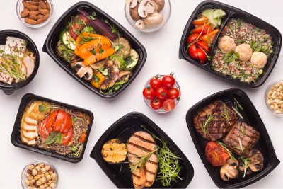 Healthy food delivery in take away boxes.