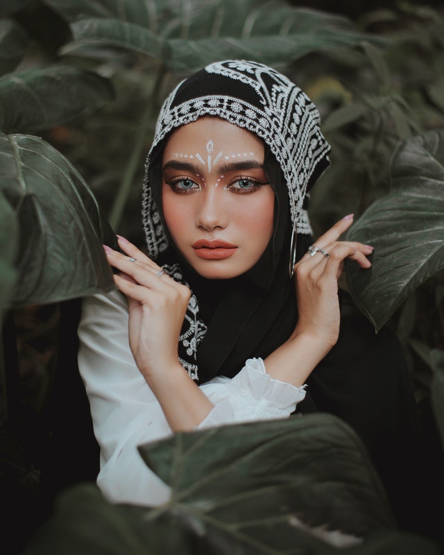 Stylish woman in hijab wearing Halal makeup