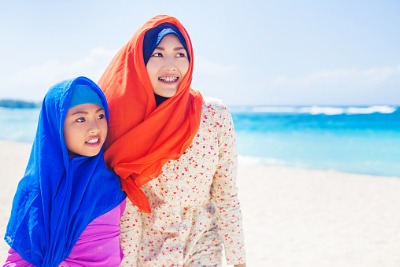 Muslim girls on a beach.
