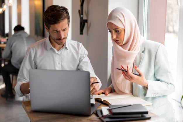 Colleagues of a Halal certifying agency working on a project.