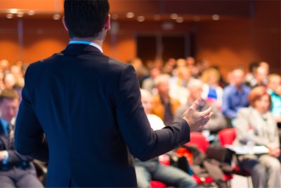 Muslim speaker doing a conference.