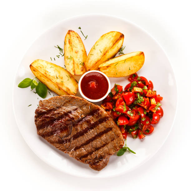 Halal beef and french fries served with tomatoes