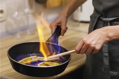 Muslim woman cooking in home.