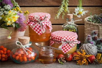 Jars of honey bottles and herbs are following Halal packaging method.