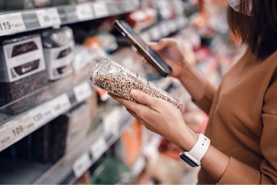 Woman reading product information.