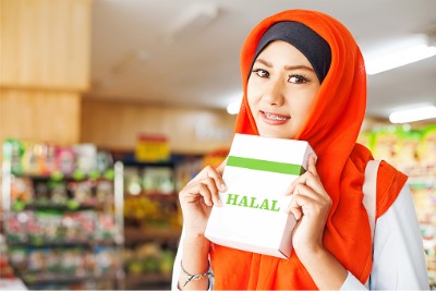 Muslim woman holding Halal.