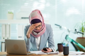 Muslimah facing pressure at work.