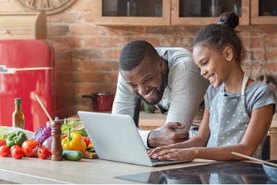 Muslim dad teaching his daughter how to cook using Youtube.