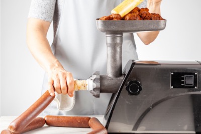 A woman making homemade sausage.